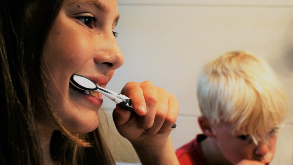 Kids Brushing Their Teeth Before School